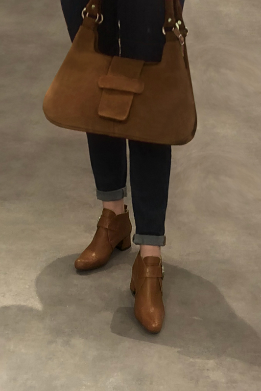 Caramel brown women's ankle boots with buckles at the front. Round toe. Low flare heels. Worn view - Florence KOOIJMAN